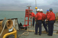 [ Photograph: Crew Snares Buoy ]