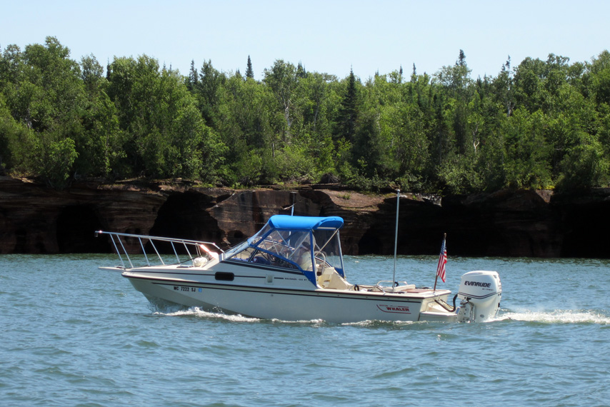 Photo: Boston Whaler boat CONTINUOUSWAVE underway on west side of Devils Island, Apostle Islands, Lake Superior, Wisconsin.