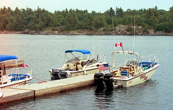 [Photo: Whalers at Henry's Fish Restaurant docks.]