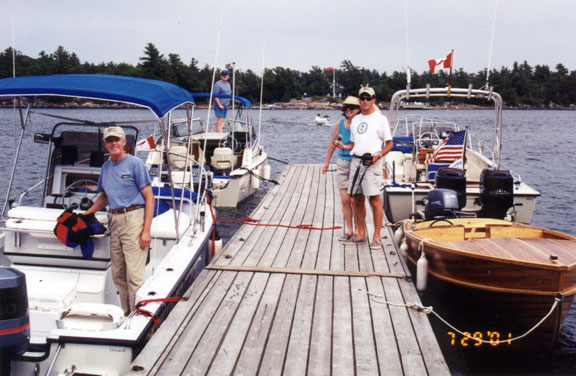 [Photo: Whalers at Henry's Fish Restaurant docks.]