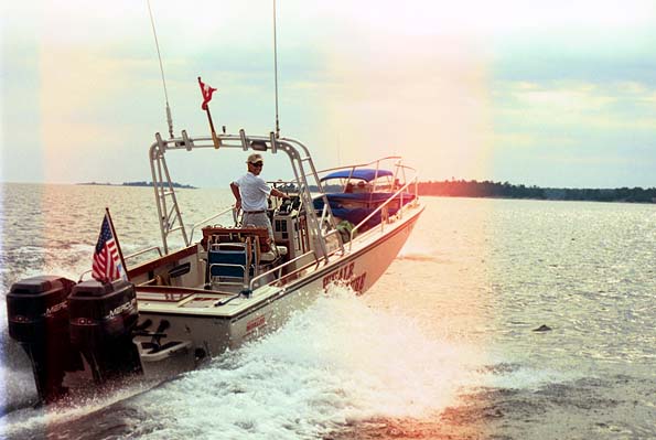 [Photo: WHALE LURE passing close abeam to port.]