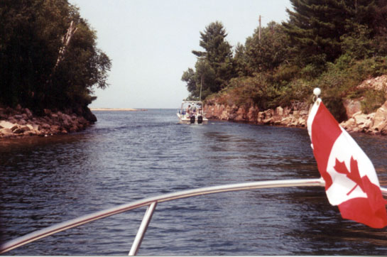 [Photo: Whalers passing through Canoe Channel.]