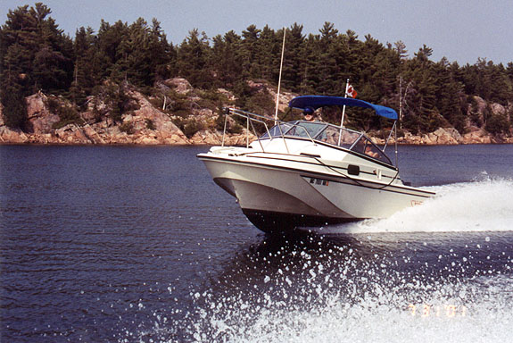 [Photo: 20-Revenge on plane in smooth water.}