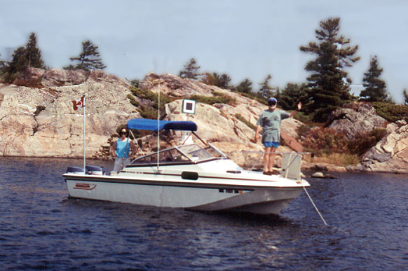 [Photo: Anchoring for lunch in rocky cove.]