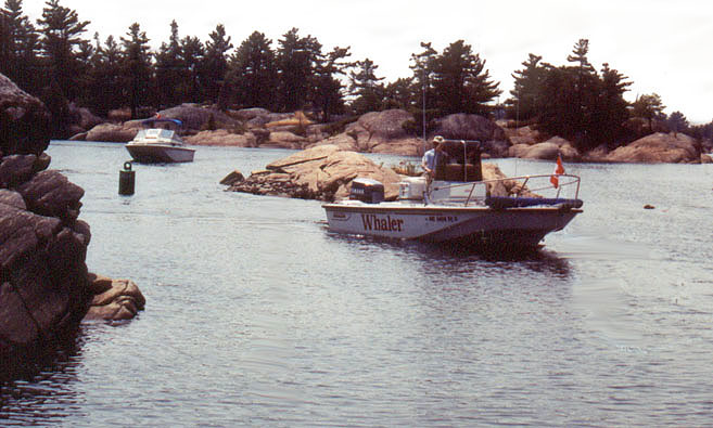 [Photo: WHALE LURE eases thru Parting Channel.}