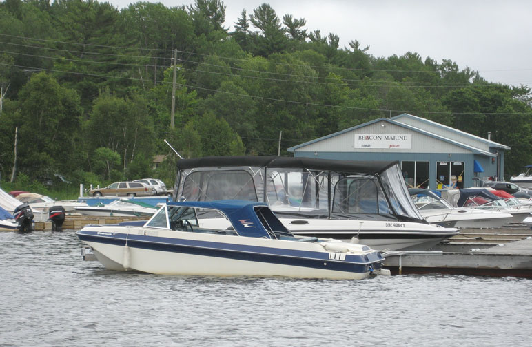 Photo: Older OMC sterndrive runabout at Beacon Marine in Pte. Au Baril Station, Ontario.