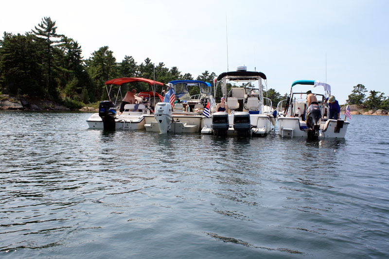 Photo: Four Boston Whaler boats rafted for lunch in wilderness anchorage, Georgian Bay.