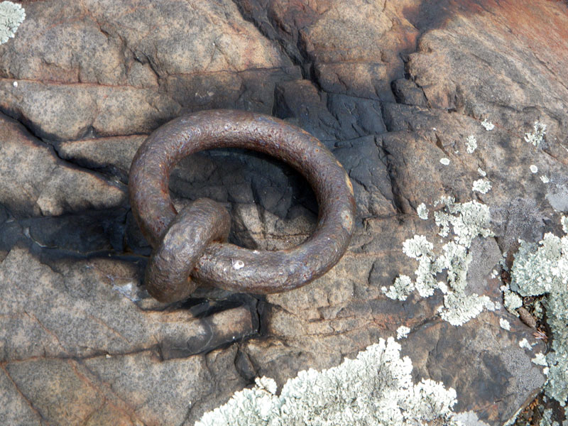 Photo: Close-up of century old iron mooring ring.
