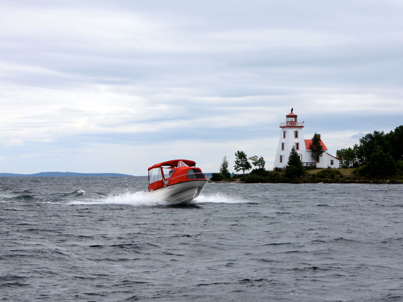 Photo: ADEQUATE passes lighthouse