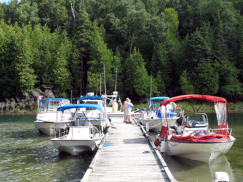 Photo: Boston Whaler boat owners chat at the dock on Nepture Island.