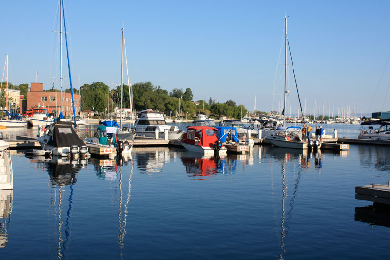 Photo: Boston Whaler boat owners enjoy a morning conversation at the dock.