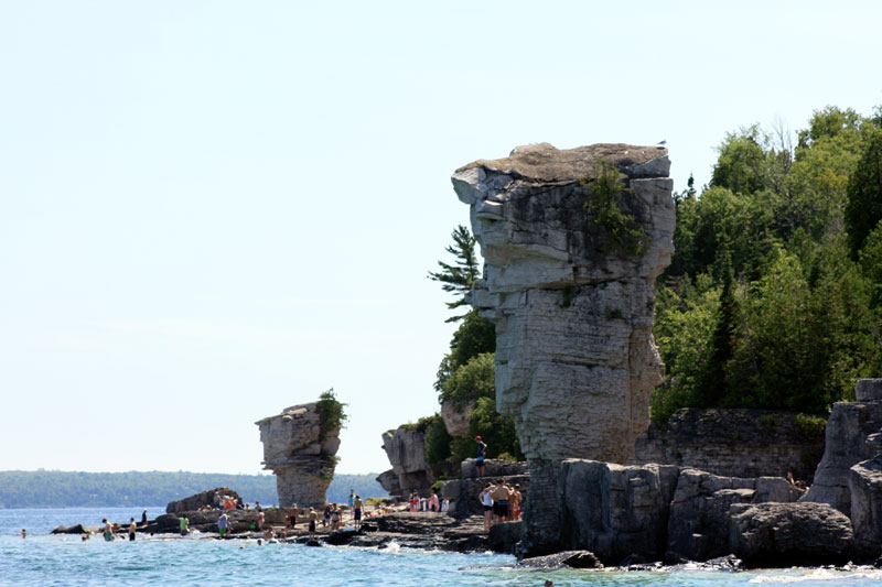Photo: Flowerpot Island shoreline with many visitors.