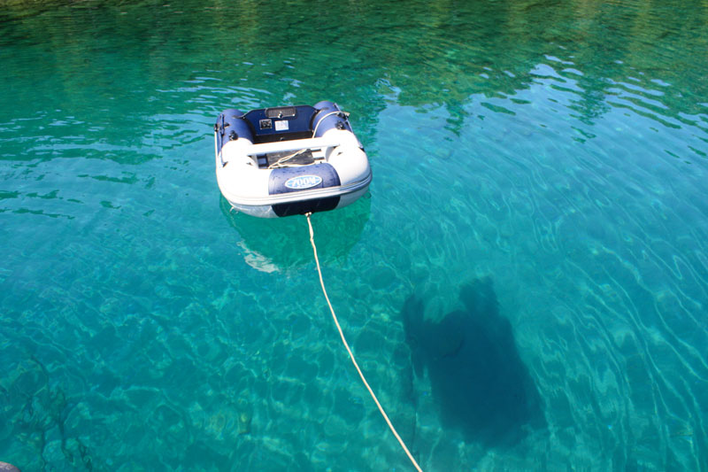 Photo: Inflatible dingy and its bottom shadow.