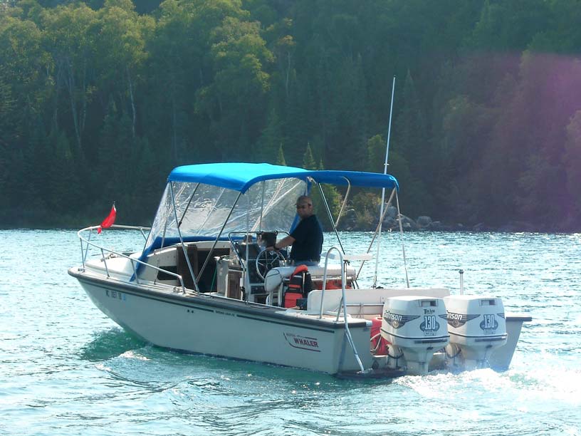 Photo: Boston Whaler OUTRAGE 25 CUDDY exiting Chippewa Harbor, Isle Royale, Lake Superior.