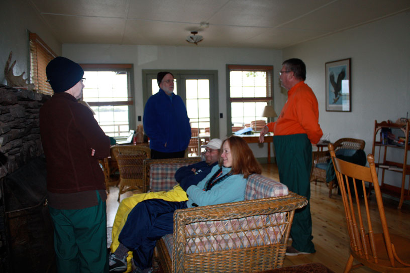 Photo: Boaters warm up around the fireplace at the Hiker's Lounge, Rock Harbor, Isle Royale, Lake Superior