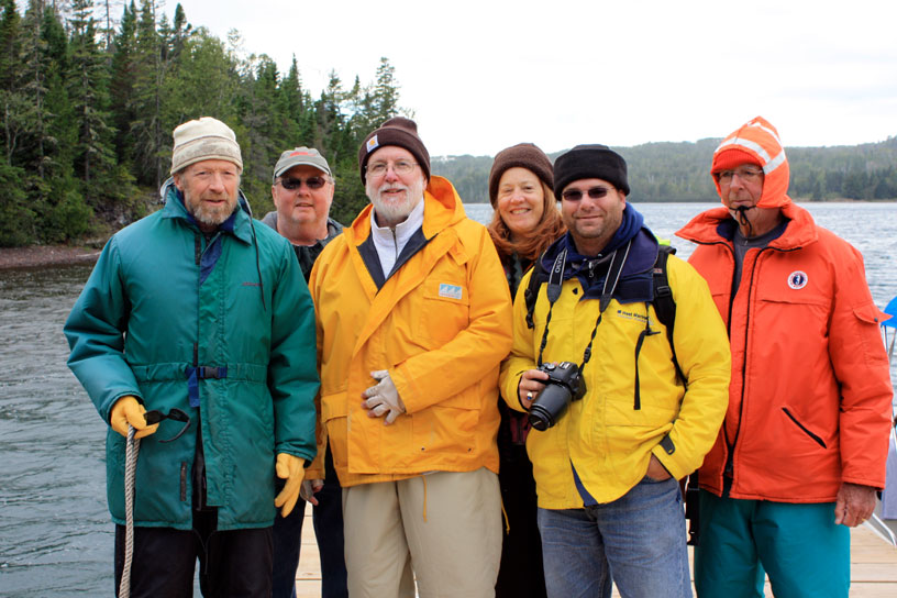 Photo: Boston Whaler boaters meet Rolfe Petersen at Edisen Fishery dock, Isle Royale National Park, Lake Superior.