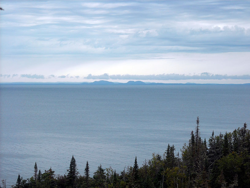 Photo: View of Canadian shore in the distance from Passage Island.
