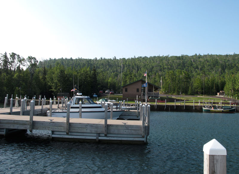 Photo: View of docks at Copper Harbor with the four boats of our fleet.