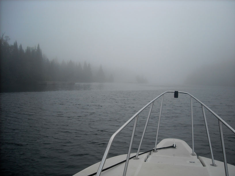 Photo: Dock at Chippewa Harbor seen from seaward in fog.