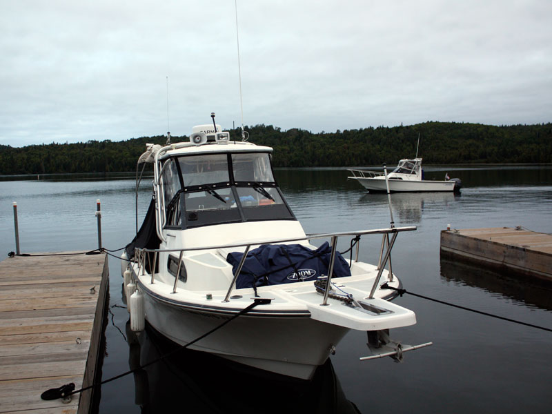 Photo: MANIC MOMENT departing Washington Harbor, Isle Royale, early morning, with HOLLY MARIE at dock in foreground