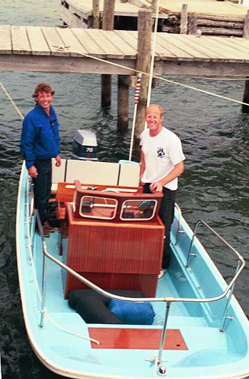 [Photo: 16-Nauset Boston Whaler at tall dock, Beaver Island.]