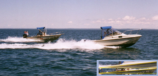 [Photo: Whaler 18 and 20 foot hulls on plane; Grand Traverse Bay.]