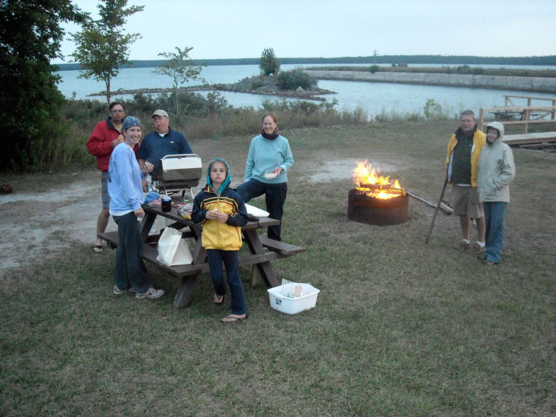 Photo: Boaters prepare for picnic dinner at Lime Island, Michigan