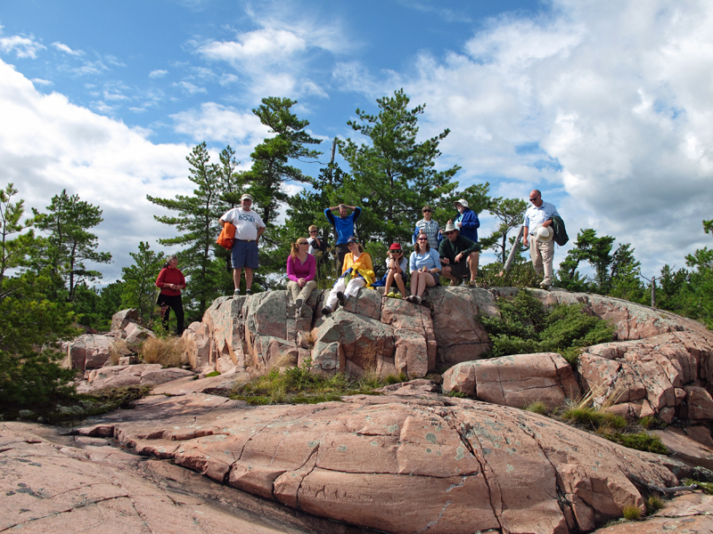 Photo: Hikers pause for a group shot atop a rocky overlook