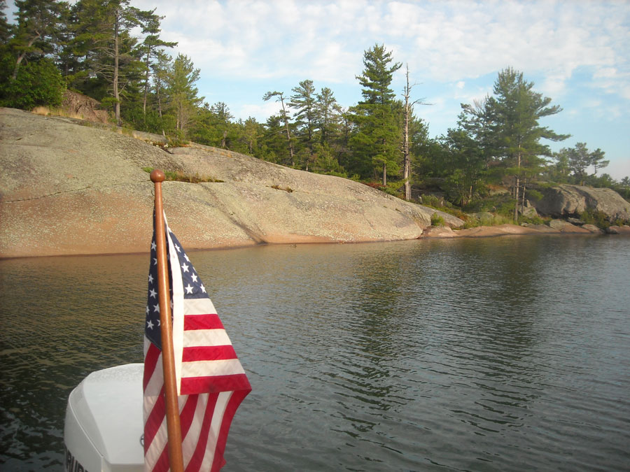 View of shoreline of South Benjamin Island from boat in small cove