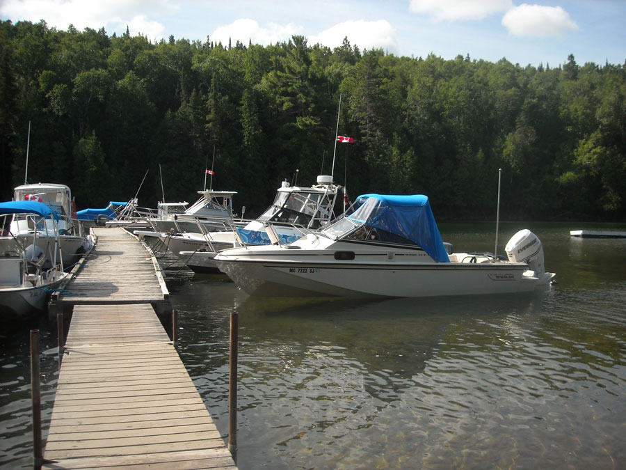 Boats tied bow-in to dock
