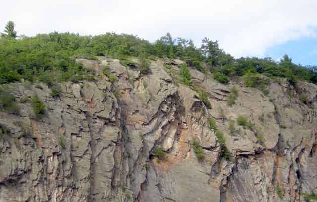 Photo: Close-up of rock formation showing faces