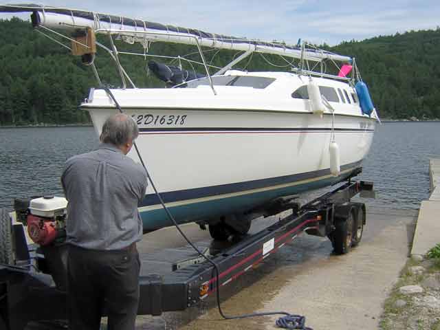 Photo: Sailboat loading onto trailer for portage at Swisha