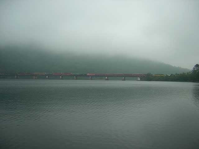 Photo: Train crosssing long trestle over Ottawa River at Mattawa, Ontario