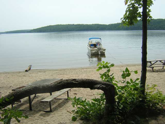 Photo: CONTINUOUSWAVE anchored off sandy beach