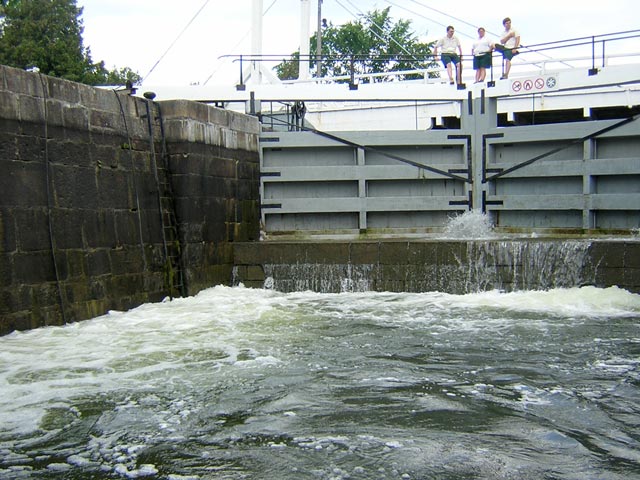 Photo: Lock chamber at low water being flooded, miter sill prominent