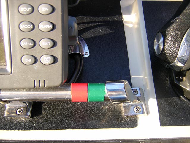 Photo: Red and green tape applied near helm to remind helmsman of buoy orientation