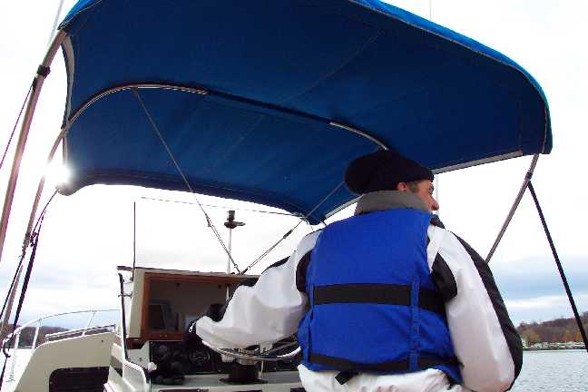 [Photo: Whaler 25 Cuddy, Pete Ferguson at helm, cold weather]