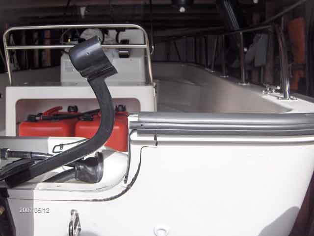 Photo: Stern view of Boston Whaler 170 MONTAUK hull showing transom with trim molding partially removed.
