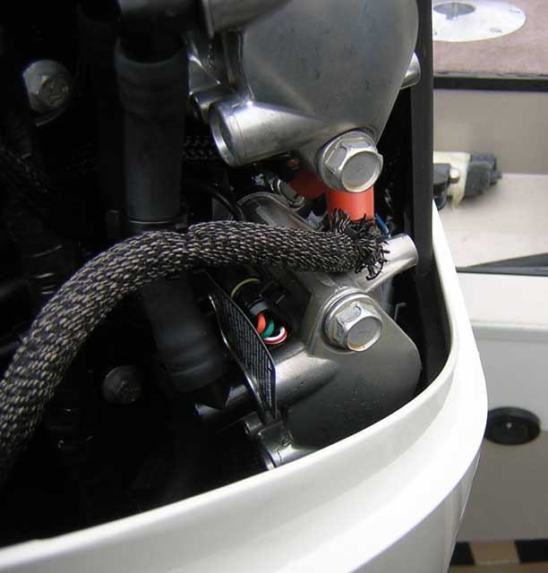 [Photo: Evinrude 225-HP E-TEC Outboard close-up cowing fit.]