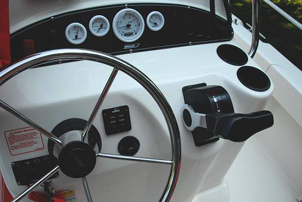 Photo: Trim tab controls installation on helm console of Boston Whaler 190 NANTUCKET.
