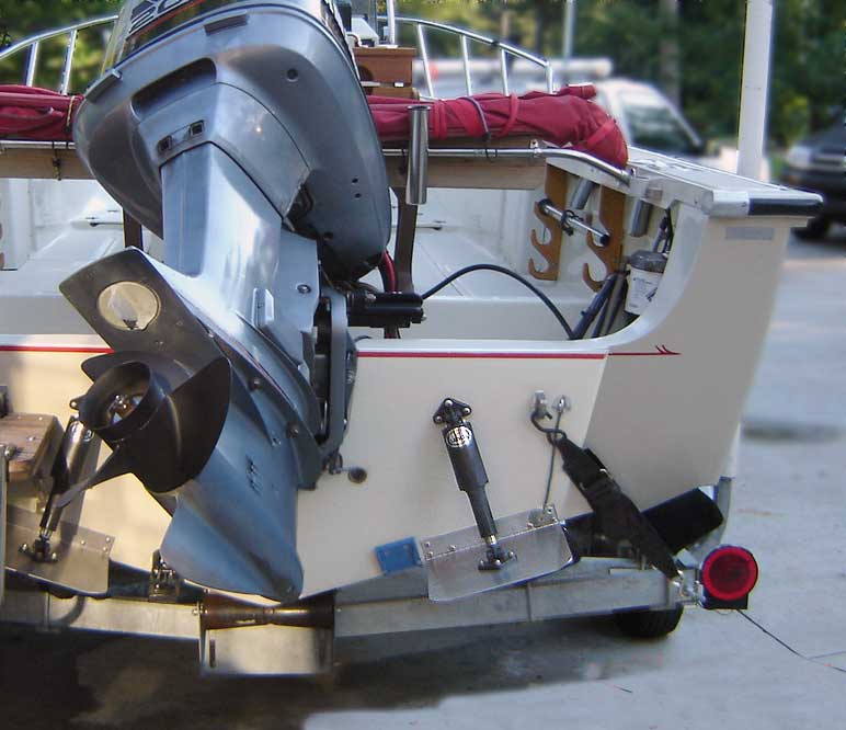 Photo: Stern view of Boston Whaler OUTRAGE 20 hull showing trim tabs mounted on raised portion of transom.