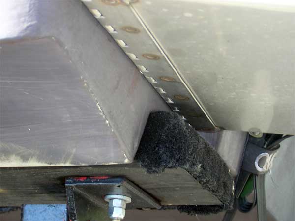 Photo: Tab installation showing change in hull bottom beneath tab surface.