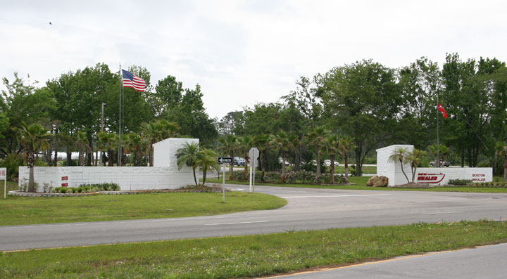 [Photo: View of Boston Whaler plant entrance from highway]