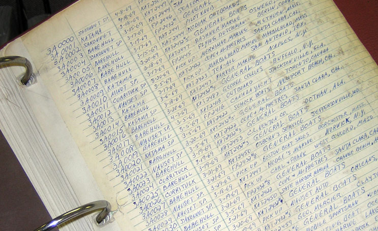 [Photo: Old books of factory records.]
