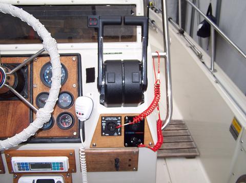 [Photo: Console view showing dual controls and ignition/safety switches]
