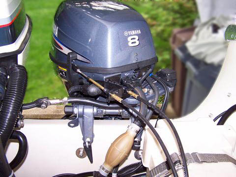 [Photo: View of transom showing engines tilted full right.]