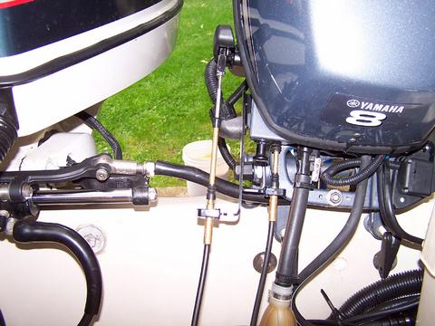 [Photo: View of transom with auxiliary engine in full up position.]