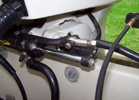 [Photo: Close up of the add-on bracket to link to the tie bar for the
		auxliary engine.]
