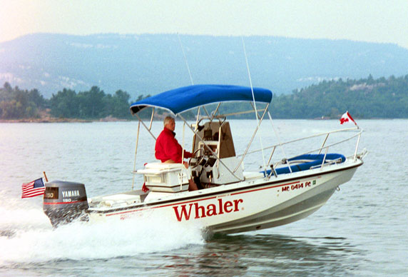 [Photo: Hole in the wall with Whaler in foreground.]