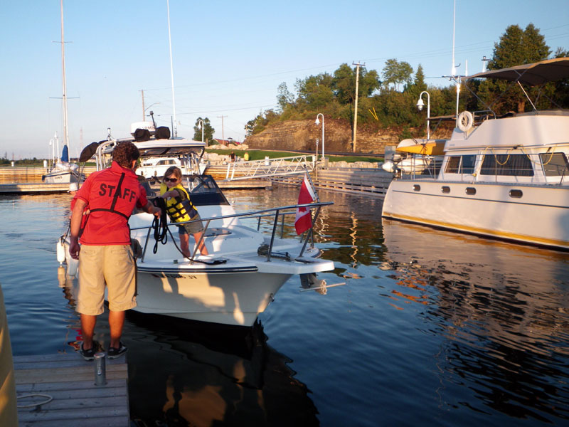 Photo: Boston Whaler 23 WALKAROUND approaches dock.
